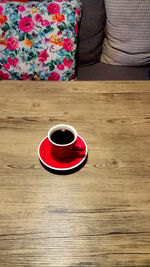 High angle view of coffee cup on table