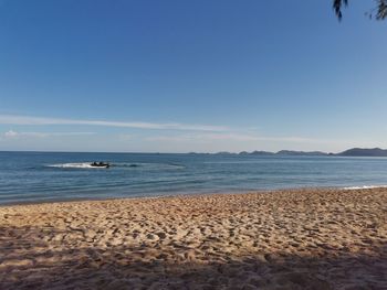 Scenic view of beach against clear sky