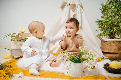 Girl playing with christmas tree at home