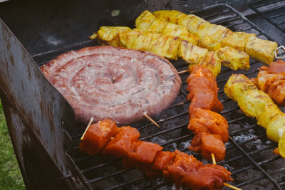 High angle view of meat on barbecue grill