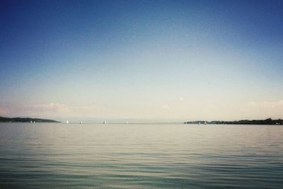 Scenic view of calm sea against clear sky