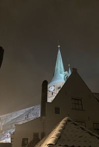 Low angle view of building against sky during winter