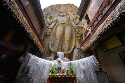 Low angle view of statue against building