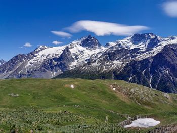 Scenic view of snowcapped mountains against sky