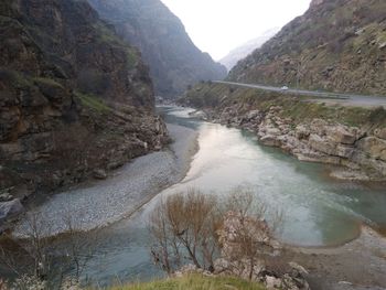 High angle view of river amidst mountains