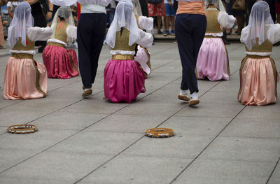 People dancing on street in city