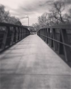 Surface level of railing against sky