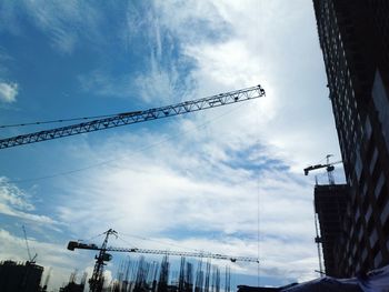 Low angle view of electricity pylon against sky