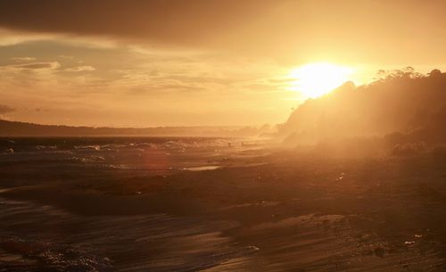 Scenic view of sunset over land
