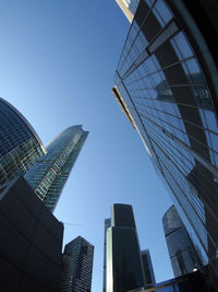 Low angle view of modern buildings against clear sky