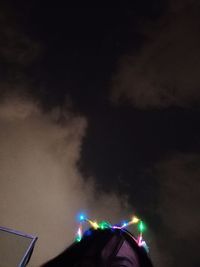 Low angle view of illuminated street light against sky at night