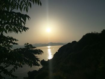 Scenic view of calm sea at sunset