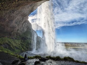 Behind the seljalandsfoss waterfall in southern iceland 