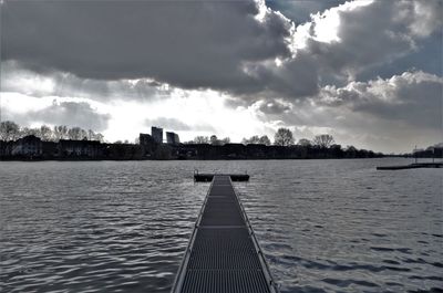 Panoramic view of city against cloudy sky