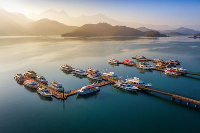 High angle view of boats in sea against sky