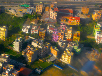 High angle view of city lit up at night