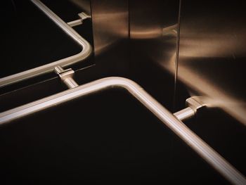 High angle view of railing against black background