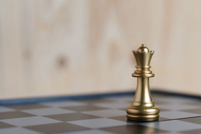 Close-up of chess piece on board