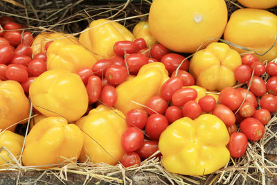 Close-up of yellow bell peppers for sale at market stall