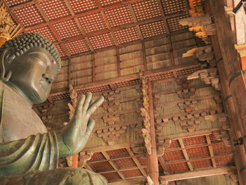 Low angle view of buddha statue