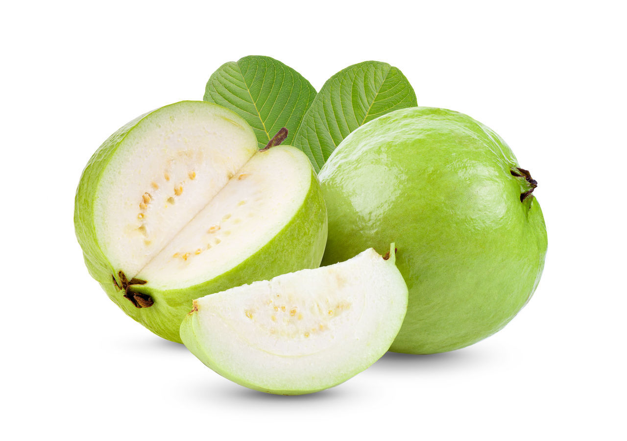 CLOSE-UP OF APPLE ON GREEN BACKGROUND