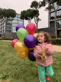 Rear view of children with balloons