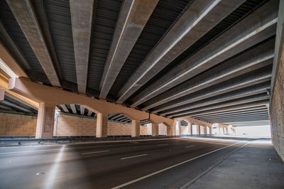 Empty road below elevated bridge