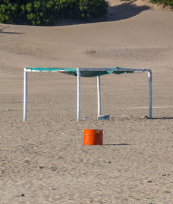 Empty chair on sand at playground