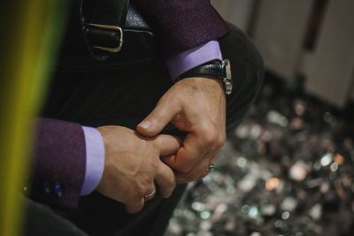 Close-up of man with hands clasped