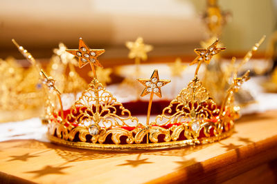 Close-up of crown on table