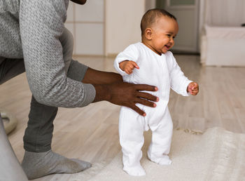 Rear view of father and son at home