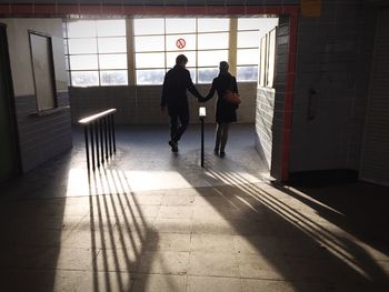 People walking in corridor