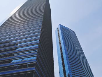 Low angle view of modern buildings against clear sky