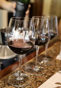 Close-up of wine glasses on table