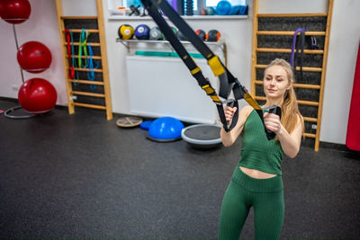 Portrait of woman exercising in gym