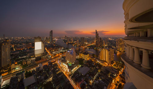 High angle view of city buildings during sunset