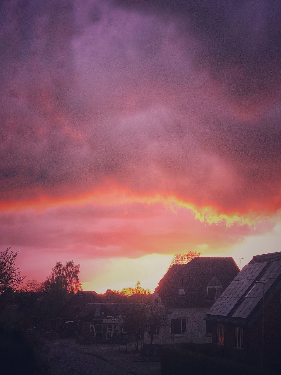 HOUSES AND BUILDINGS AGAINST DRAMATIC SKY