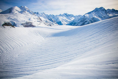 Scenic view of snowcapped mountains against sky