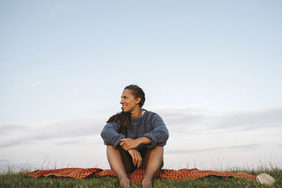 Woman relaxing on meadow