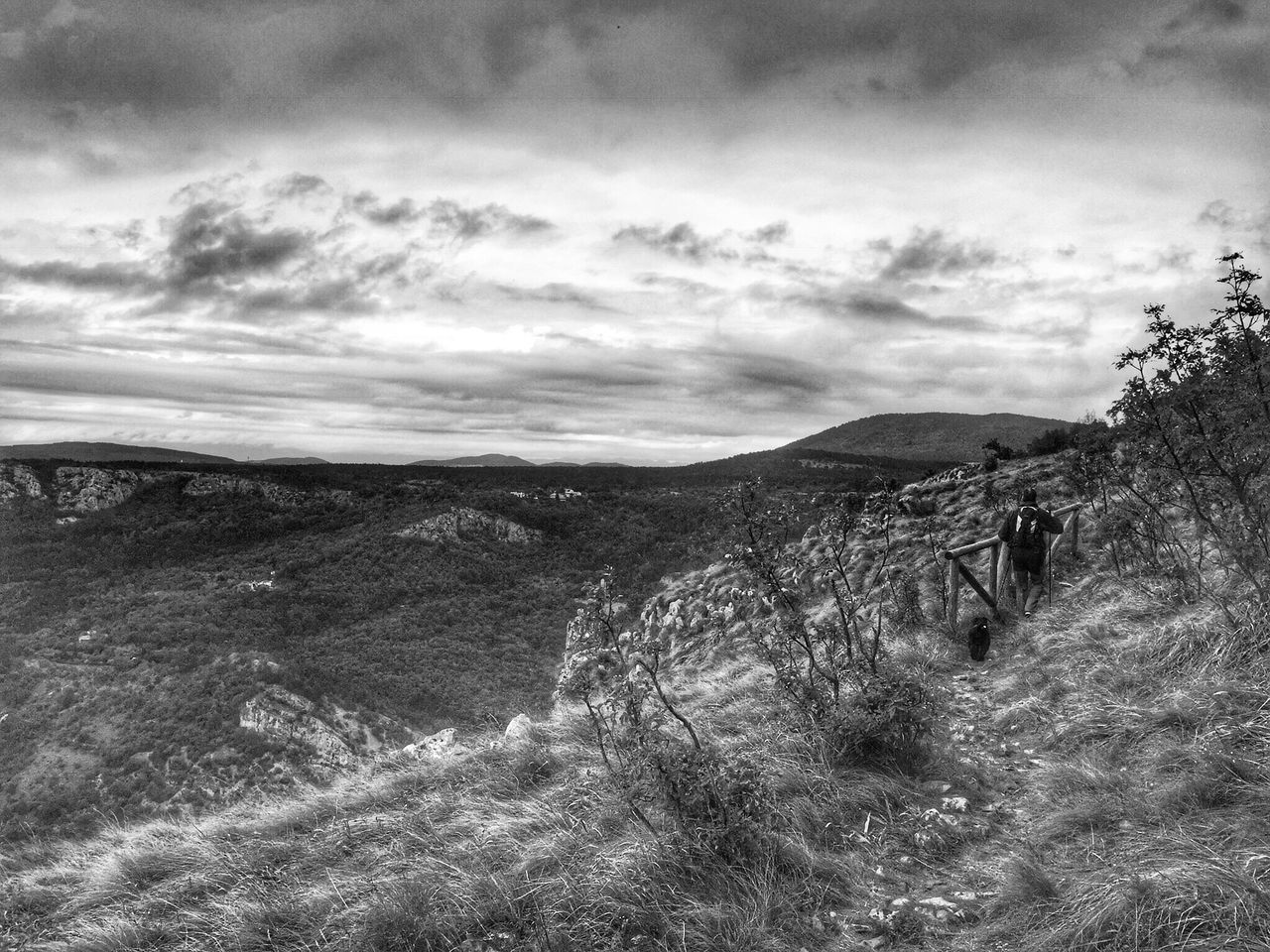 landscape, tranquil scene, tranquility, solitude, sky, scenics, non-urban scene, nature, remote, field, cloud, outdoors, day, non urban scene, beauty in nature, grassy, horizon over land, cloud - sky, countryside, no people, black and white, majestic