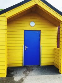 Closed door of yellow building