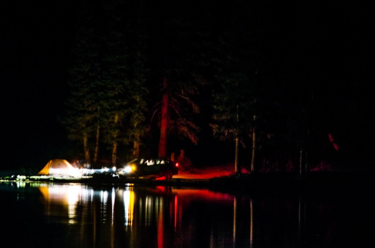 water, waterfront, reflection, night, illuminated, lake, tranquility, tranquil scene, nautical vessel, tree, river, scenics, boat, nature, beauty in nature, sky, idyllic, calm, outdoors, clear sky