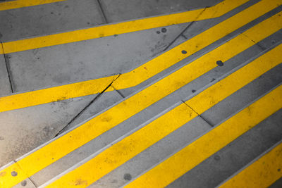 High angle view of yellow zebra crossing on road