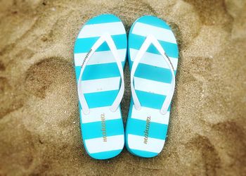 High angle view of shoes on beach