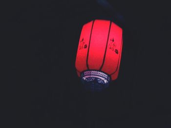 Close-up of lantern hanging on wall