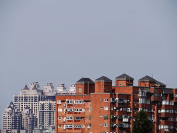 Low angle view of buildings against clear sky