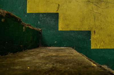 Close-up of yellow door on wall