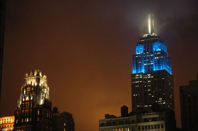 Illuminated buildings in city at night