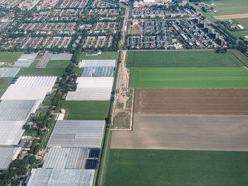 High angle view of city street amidst field