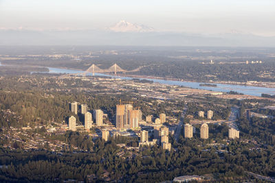 High angle view of city buildings against sky